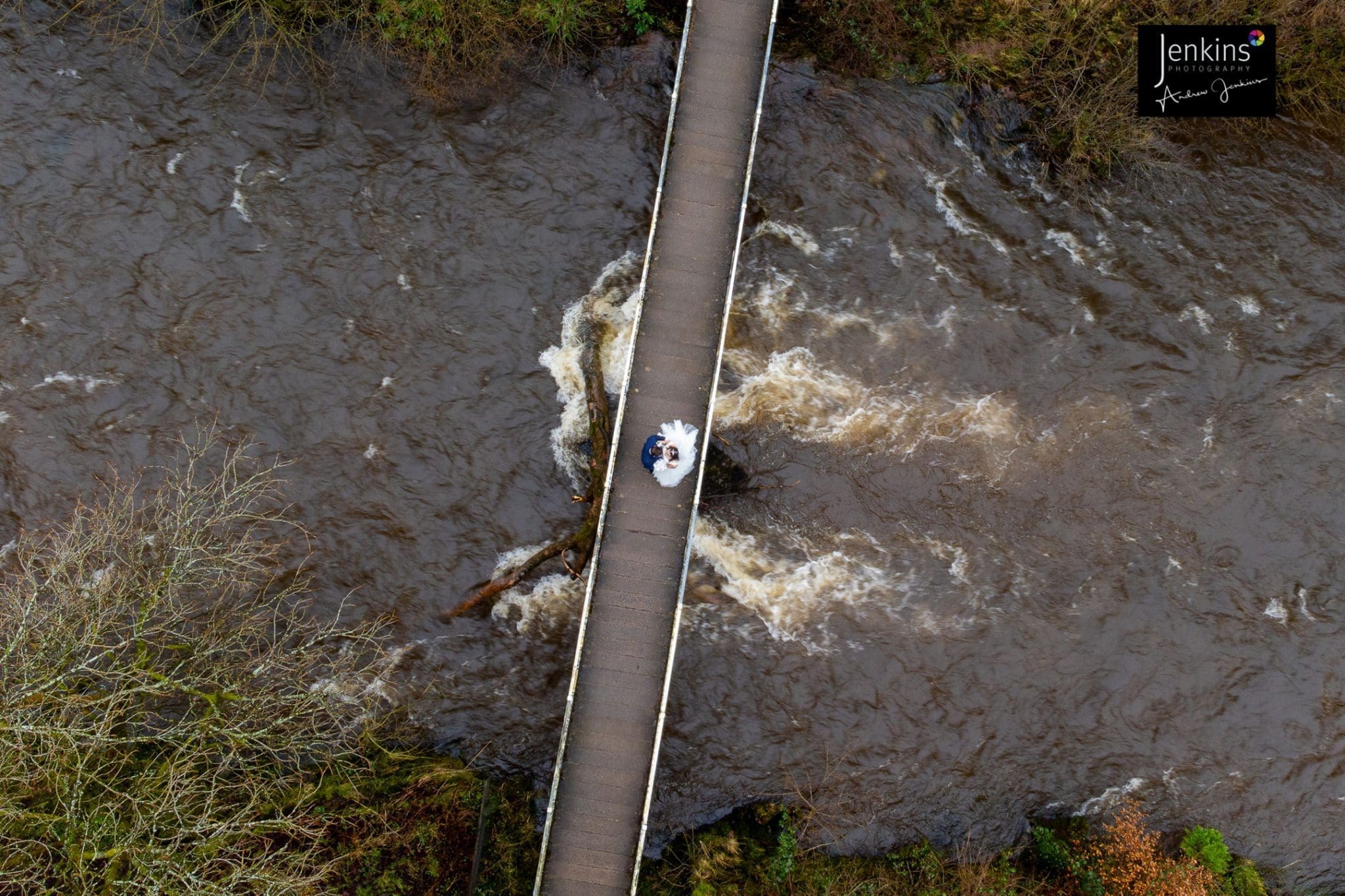 An overhead shot of our Bride & Groom on the Pattie bridge on the river Tawe at Craig Y Nos Castle