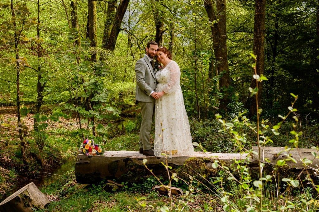 beautiful wedding photo of the bride and groom in the grounds of craig y nos castle and ountry park
