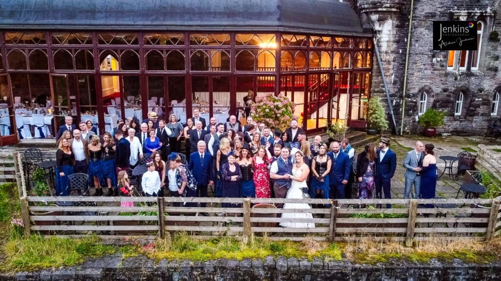 Group wedding photo with the drone at craig y nos castle with Jenkins photography 
